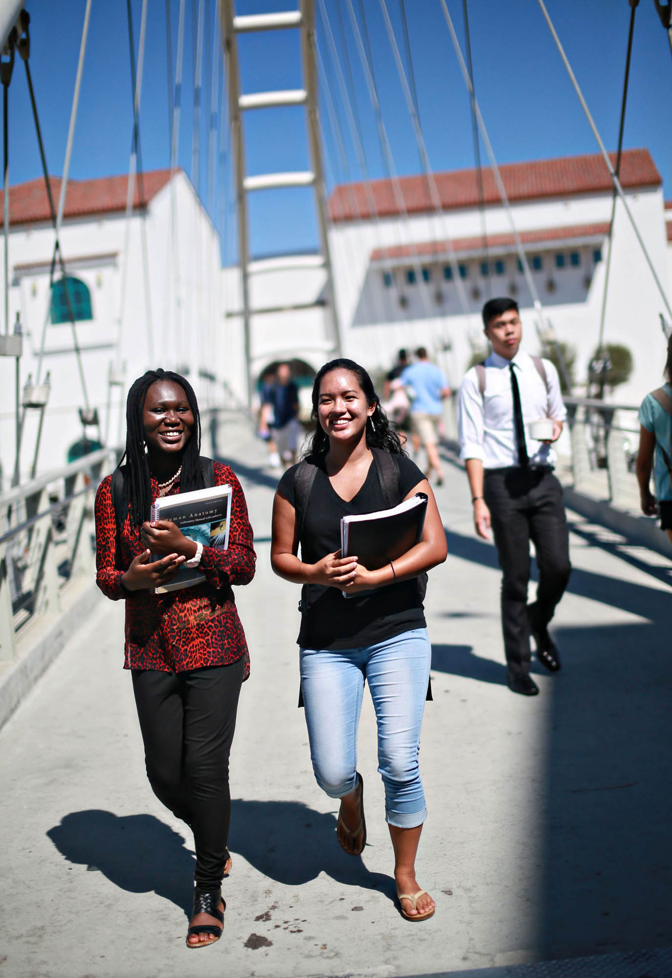 Students walking on Aztec Bridge